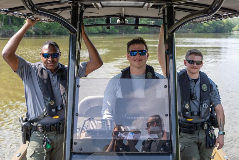 Three officers on a boat